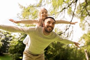 happy family having fun in summer park